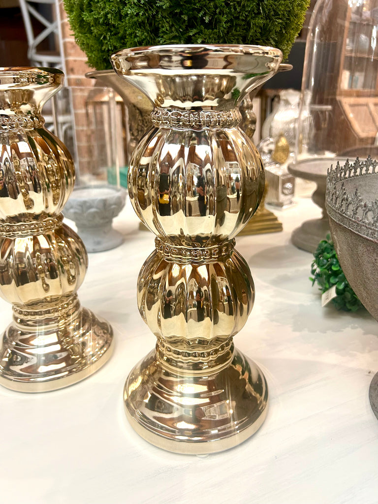 Wide gold coloured candle holder