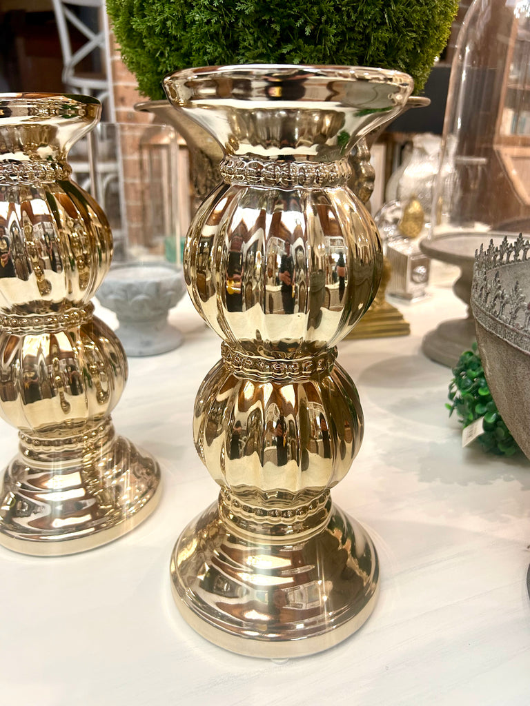 Wide gold coloured candle holder