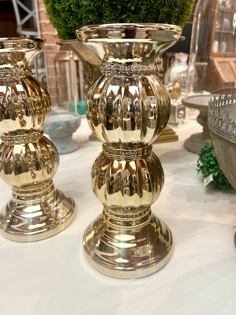 Wide gold coloured candle holder